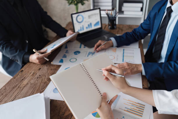 istock Business team discussing working analyzing with financial data and marketing growth report graph in team, presentation on laptop in office 1483761645