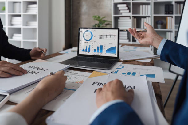 istock Business team discussing working analyzing with financial data and marketing growth report graph in team, presentation on laptop in office 1483761978