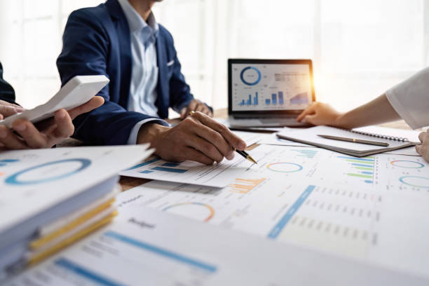 istock Multicultural professional businesspeople working together on research plan in boardroom 1483762104