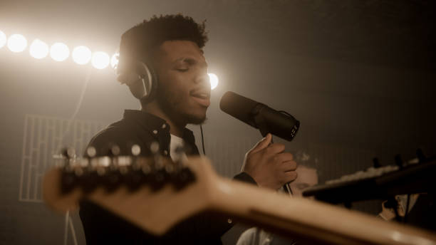 istock Vocalist sings new composition into microphone 1483764698