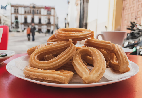 Churros with sugar and chocolate sauce