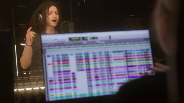 istock Professional singer in headphones sings composition 1483766916