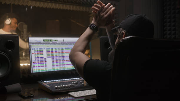 istock Sound engineer applauds to professional singer 1483768431
