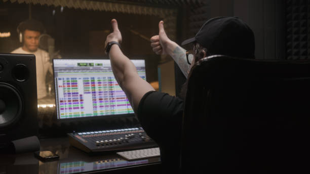 istock Sound engineer applauds to professional singer 1483768524