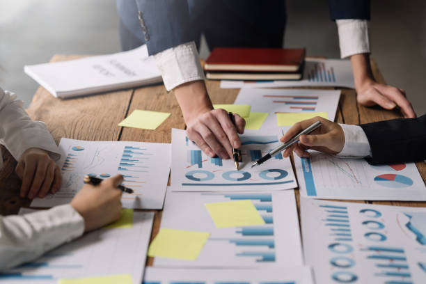 istock Group of businessmen explaining the concept marketing strategy analyze graphs and charts on corporate growth at company meeting. 1483768596