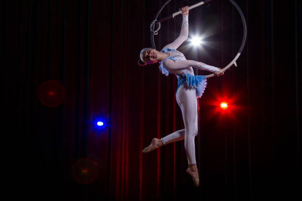 istock Circus acrobats gymnasts perform on a stage dark background. 1483770609
