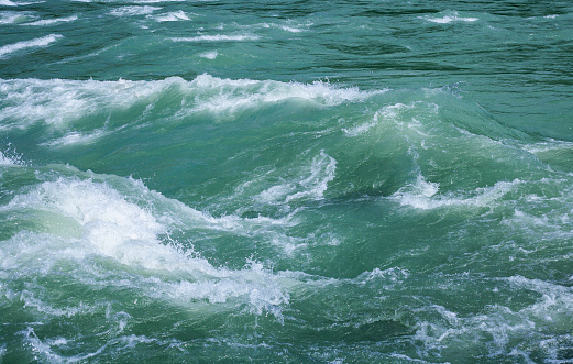 Waves on the surface of the river. Background. Texture.