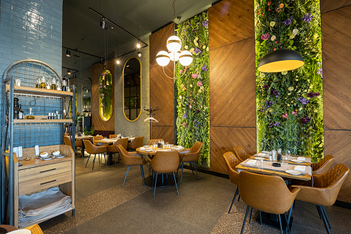 Interior of a luxury restaurant with flower decorated walls