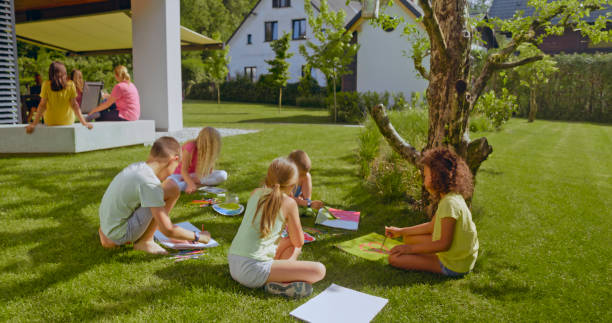 istock Children drawing in garden 1483772727