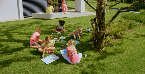 istock Children drawing in garden 1483772746