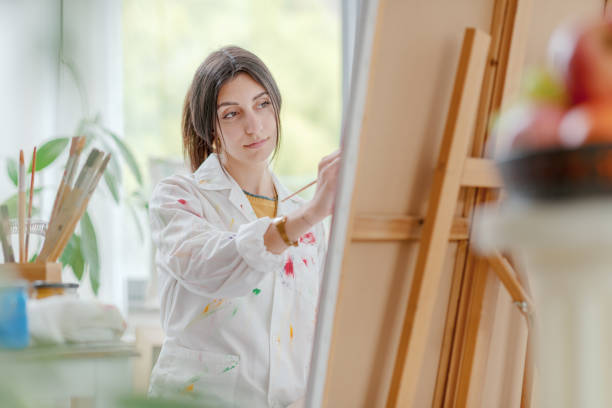 istock Creative artist painting on canvas 1483773381