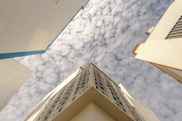 Upper view of house blocks against a blue cloudy sky