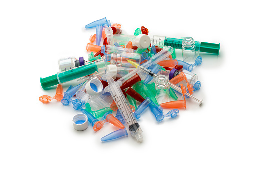 Pile of Microcentrifuge Tubes , syringes, gloves- Medical Plastic