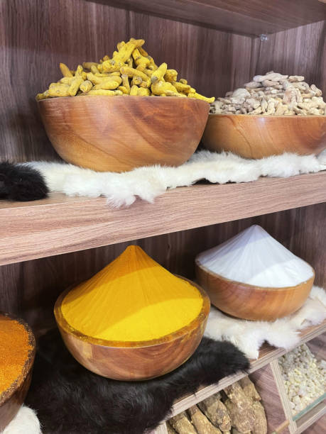 Different colorful spices on the shelves.