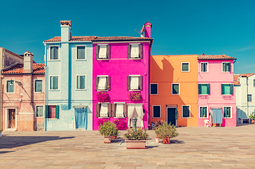 Colorful painted houses on Burano island near Venice, Italy. Scenic Italian town