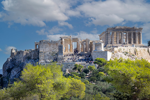 Athens, Greece - October 17, 2022: View of the Acropolis of Athens with Parthenon from Muse Hill on a background of blue sky