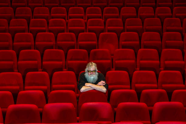 istock Concept loneliness :One man  sits in Empty cinema or theatre. 1483782203