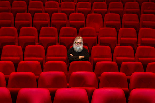istock Concept loneliness :One man  sits in Empty cinema or theatre. 1483782301