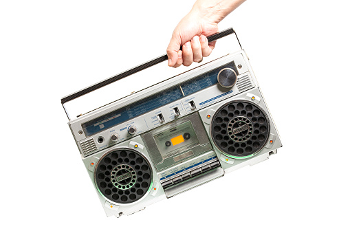 Retro ghetto radio boom box cassette recorder from 80s. in hand