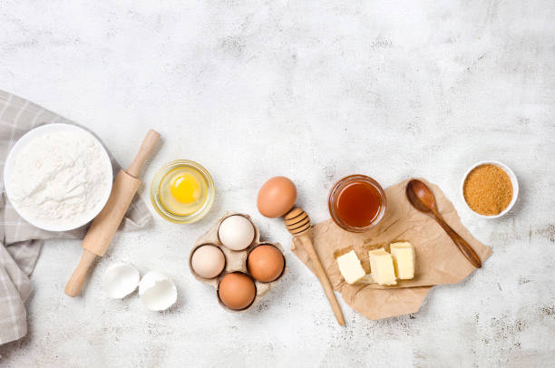 istock Ingredients for baking on a culinary background. Eggs, flour, cinnamon, sugar, soda on the kitchen table. 1483790797