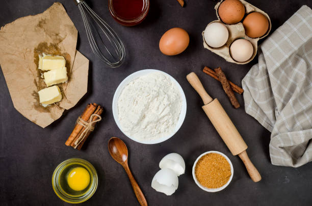 istock Ingredients for baking on a culinary background. Eggs, flour, cinnamon, sugar, soda on the kitchen table. 1483790822
