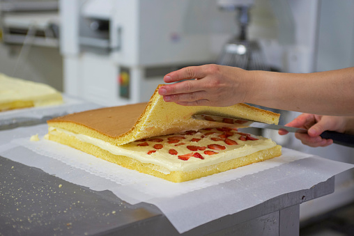 artisanal preparation of pastry desserts - cake with strawberries