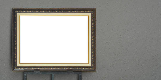 istock front view white paper on golden and brown wooden rectangular frame on black steel stand, grey cement wall background, object, decor, fashion, gift, photo, banner, template, copy space 1483799518