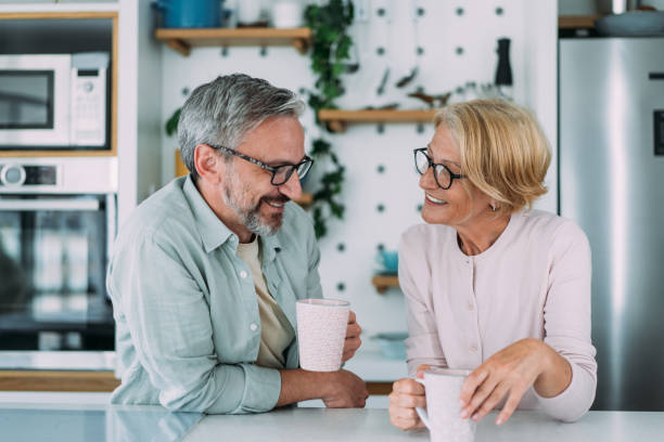 istock Lovely couple drinking coffee at home. 1483802378