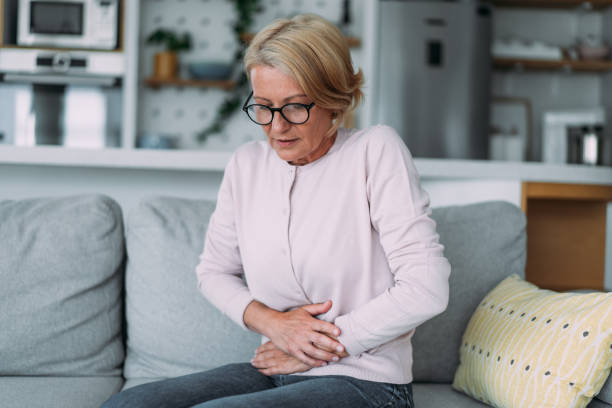 Woman suffering from period pains. stock photo
