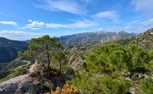 Mountain landscape with dramatic clouds in the Sierras de Tejada, Province of Malaga, Andlusia, Spain