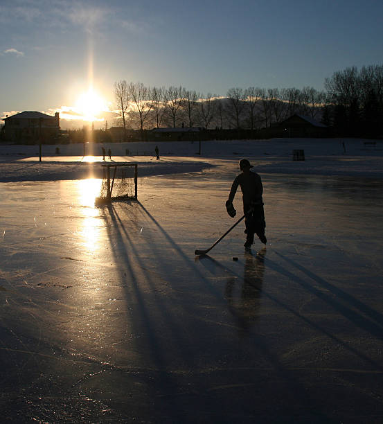istock Hockey Player on Outdoor Ice Rink 148380717