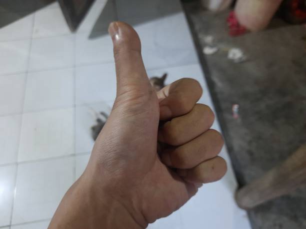istock asian hand showing thumbs up whatever happens everything will be fine 1483809273