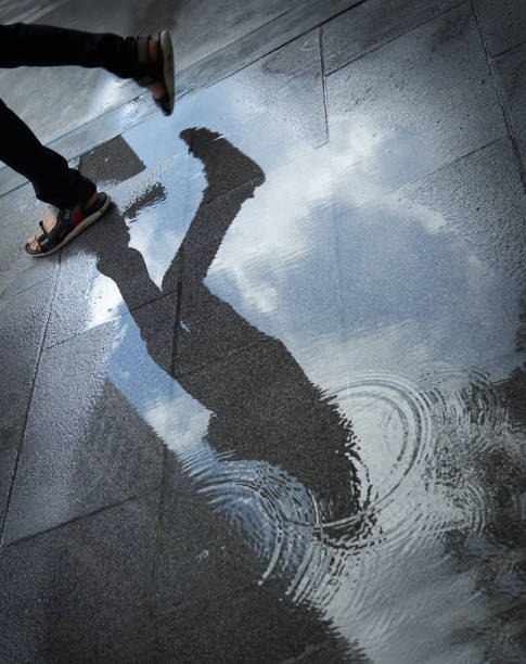 istock Puddle of water in rain - selective focus 1483809480