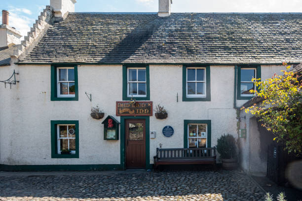 Culross, Fife, Scotland, UK. Exterior of and entrance to the Red Lion Inn, a pub situated in a 16th century building in the centre of historic Culross.