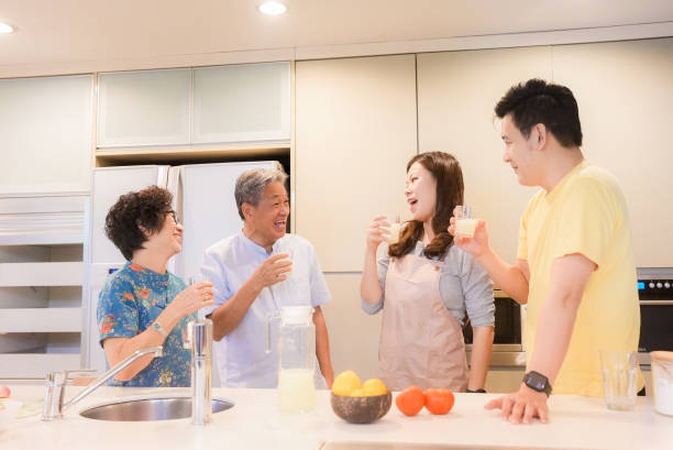 istock Lively relaxed two generation family gathering in kitchen 1483810897