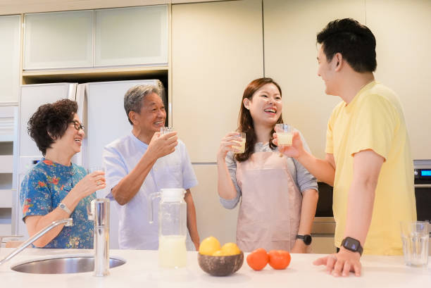istock Lively relaxed two generation family gathering in kitchen 1483810922