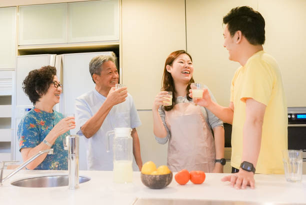 istock Lively relaxed two generation family gathering in kitchen 1483810944