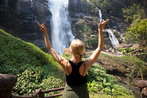Traveler enjoy near by waterfall in Chiang Mai, Thailand