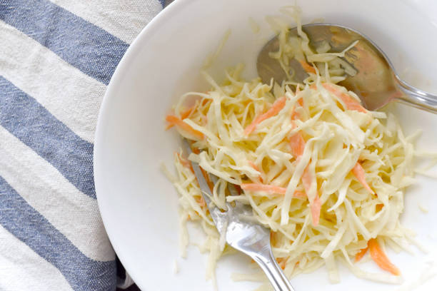 istock Coleslaw salad with carrot and cabbage in a bowl. 1483819921