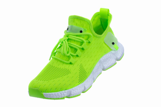 istock Green sneaker made of fabric with a white sole on a white shoe. 1483820418