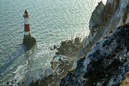 Famous place in England Beachy Head lighthouse sunset East Sussex Southern coast of England English Channel Europe