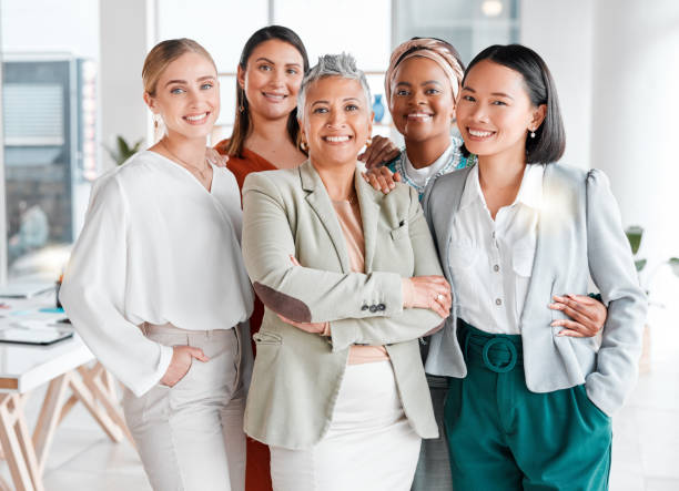 istock Portrait, diversity and business women support, teamwork and group empowerment for office leadership. Career hug and solidarity of asian, black woman and senior people or employees at global company 1483821822