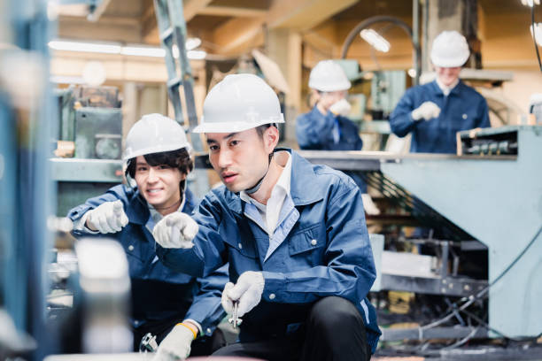 Factory worker checking for safety by pointing Factory worker checking for safety by pointing safety first at work stock pictures, royalty-free photos & images