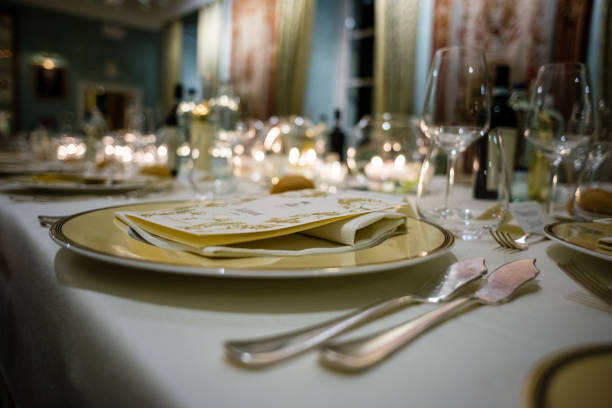 table in a luxury restaurant, set for a gala dinner table in a luxury restaurant, set for a gala dinner, on the table various candles gala stock pictures, royalty-free photos & images