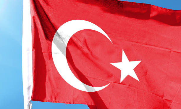 istock Turkish flag on cloudy sky. waving in the sky 1483831998