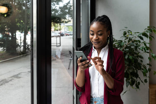 istock Concentrated busy business person in formal suit using cellphone software applications, web surfing useful information, typing message, sending email or consulting client remotely 1483833659