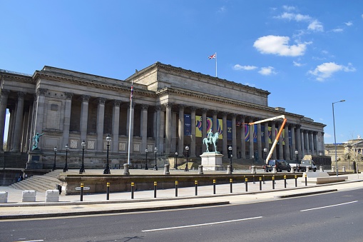 Liverpool, Merseyside, United Kingdom - April 18 2023: St George's Hall, Liverpool, setting up banners in preparation for the 67th Eurovision Song Contest 2023 in support of Ukraine, 'United by Music'.