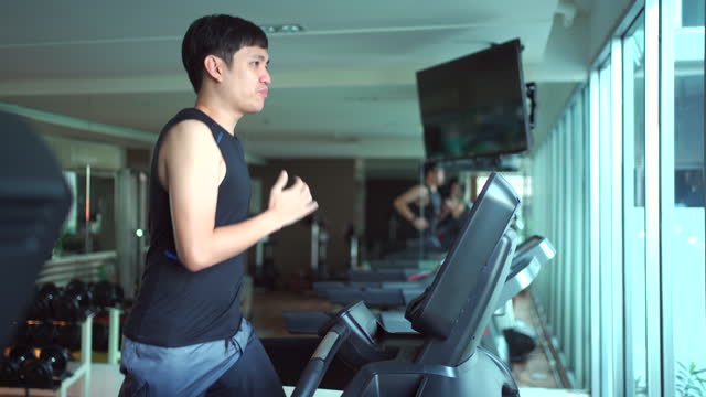 Man running on treadmill.