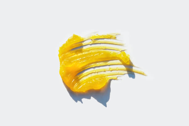 istock Yellow textured cannabis oil on a white background. 1483839463