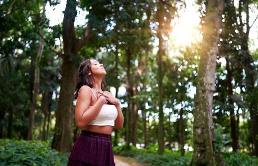 brazilian young woman breathing fresh air in a park